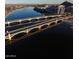 Breathtaking aerial view of bridges spanning a calm river with city buildings and a mountain in the distance at 1619 E Del Rio Dr, Tempe, AZ 85282