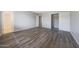 A spacious bedroom is painted in neutral tones and features durable flooring and a closet with sliding doors at 1619 E Del Rio Dr, Tempe, AZ 85282