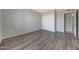 An empty bedroom features durable floors, a neutral color palette, and a closet with sliding doors at 1619 E Del Rio Dr, Tempe, AZ 85282