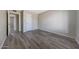 An empty bedroom is ready to furnish and features durable floors, neutral walls, and closet at 1619 E Del Rio Dr, Tempe, AZ 85282