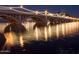Night view of a lit bridge over water, creating a beautiful reflection at 1619 E Del Rio Dr, Tempe, AZ 85282