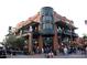 Exterior view of Starbucks Coffee located in a busy commercial area, showing pedestrian activity and signage at 1619 E Del Rio Dr, Tempe, AZ 85282