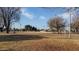 Recreational field with volleyball net, benches, and sparse landscaping at 1619 E Del Rio Dr, Tempe, AZ 85282
