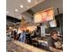 Busy restaurant interior with staff preparing customer orders at 1619 E Del Rio Dr, Tempe, AZ 85282