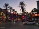 Street scene featuring palm trees and restaurants under the night sky at 1619 E Del Rio Dr, Tempe, AZ 85282