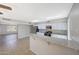Bright kitchen featuring white cabinets, stainless steel appliances, and a granite breakfast bar at 1619 E Del Rio Dr, Tempe, AZ 85282