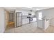 Modern kitchen featuring granite counters, stainless steel appliances, and convenient access to the hallway at 1619 E Del Rio Dr, Tempe, AZ 85282