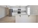 Well-lit kitchen with granite countertops, stainless steel appliances, and white cabinetry at 1619 E Del Rio Dr, Tempe, AZ 85282