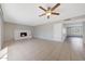 Spacious living room with tile flooring, a fireplace, and a ceiling fan at 1619 E Del Rio Dr, Tempe, AZ 85282
