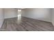 Spacious living room featuring new flooring and fresh paint at 1619 E Del Rio Dr, Tempe, AZ 85282