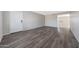 Open living room featuring new flooring and fresh paint at 1619 E Del Rio Dr, Tempe, AZ 85282