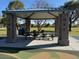 A covered picnic area with tables and seating, set in a park with green grass, ideal for community gatherings and outdoor enjoyment at 1619 E Del Rio Dr, Tempe, AZ 85282