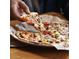 Close-up of pizza slice with cheese stretching at 1619 E Del Rio Dr, Tempe, AZ 85282