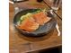 Close-up of a sashimi plate with fresh salmon and lemon wedges at 1619 E Del Rio Dr, Tempe, AZ 85282