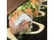 Delicious sushi roll topped with avocado and salmon at 1619 E Del Rio Dr, Tempe, AZ 85282