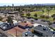 Aerial view of the home with beautiful landscaping and mature shade trees at 1624 W Thomas Rd, Phoenix, AZ 85015