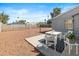 Backyard features a concrete patio and a decorative rock landscape design at 1624 W Thomas Rd, Phoenix, AZ 85015