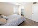 Comfortable bedroom with a queen-sized bed, tile flooring and a view of the closet at 1624 W Thomas Rd, Phoenix, AZ 85015