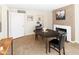 Inviting dining area features a fireplace, tile flooring and a neutral color palette at 1624 W Thomas Rd, Phoenix, AZ 85015