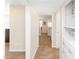 Hallway with tile flooring, light walls, and access to other rooms in the home at 1624 W Thomas Rd, Phoenix, AZ 85015