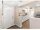This kitchen features stainless steel appliances, white cabinets and tile floors at 1624 W Thomas Rd, Phoenix, AZ 85015