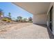 A covered backyard patio with brick pavers overlooking a hillside at 16405 N Cobblestone Ln, Fountain Hills, AZ 85268