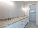 Bathroom featuring dual sinks, granite countertops, and custom cabinets at 16405 N Cobblestone Ln, Fountain Hills, AZ 85268