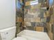 A tiled bathroom with a bathtub, shower, and toilet at 16405 N Cobblestone Ln, Fountain Hills, AZ 85268