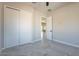 Bedroom with gray walls, tile flooring, closet with sliding doors, and white trim at 16405 N Cobblestone Ln, Fountain Hills, AZ 85268