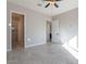Bedroom with tile floors and view into both the closet and bathroom at 16405 N Cobblestone Ln, Fountain Hills, AZ 85268