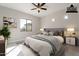 Serene bedroom featuring a queen bed, ample natural light from large windows, and minimalist decor at 16405 N Cobblestone Ln, Fountain Hills, AZ 85268