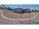Street view of modern one-story home featuring a neutral color scheme, desert landscaping, and a two-car garage at 16405 N Cobblestone Ln, Fountain Hills, AZ 85268