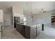 Modern kitchen featuring a large island with granite countertops and stainless steel appliances at 16405 N Cobblestone Ln, Fountain Hills, AZ 85268