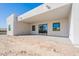 Covered patio with brick floor, sliding glass door, and modern lighting, ideal for outdoor entertaining and relaxation at 16405 N Cobblestone Ln, Fountain Hills, AZ 85268