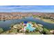 An impressive pool and recreation area are visible in this aerial view of the community and lake at 17002 S 178Th Ave, Goodyear, AZ 85338