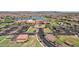 Aerial view of the community clubhouse with a pool, parking and lush landscaping at 17002 S 178Th Ave, Goodyear, AZ 85338