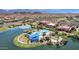 Aerial image of community pool, bocce ball, and surrounding area with lush landscaping, and lake views at 17002 S 178Th Ave, Goodyear, AZ 85338