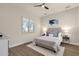 Cozy bedroom with wood floors, plantation shutters, and a plush bed with stylish decor at 17002 S 178Th Ave, Goodyear, AZ 85338