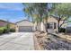 Charming one-story home with well-maintained landscaping and a two-car garage at 17002 S 178Th Ave, Goodyear, AZ 85338