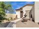 Charming front entrance with a decorative fountain, potted plants, and a well-manicured courtyard at 17002 S 178Th Ave, Goodyear, AZ 85338