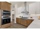Kitchen with stainless appliances, including built-in oven and gas cooktop at 17002 S 178Th Ave, Goodyear, AZ 85338