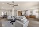 Open-concept living area connects to kitchen, dining and flows with natural light at 17002 S 178Th Ave, Goodyear, AZ 85338