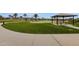 Community park with a putting green, picnic area, pavilion and well manicured grass at 17002 S 178Th Ave, Goodyear, AZ 85338