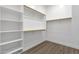 Spacious walk-in closet with shelving and clothing rods, providing ample storage space at 17002 S 178Th Ave, Goodyear, AZ 85338