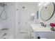 Bright bathroom features a shower/tub combo, marble floors, and a modern-style vanity with marble countertop at 17241 N 16Th Dr # 1, Phoenix, AZ 85023