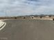 Street view of a street in a neighborhood surrounded by houses and mountains at 17808 W Sanna St, Waddell, AZ 85355
