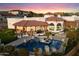 Aerial view of luxury home showcases a stunning pool, outdoor living spaces, and meticulous landscaping at 18116 N 14Th St, Phoenix, AZ 85022