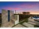 Luxurious backyard with outdoor shower and a waterfall feature flowing into the pool at 18116 N 14Th St, Phoenix, AZ 85022