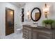 Bathroom featuring elegant fixtures, dual sconces and unique mirrors at 18116 N 14Th St, Phoenix, AZ 85022