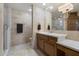 Elegant bathroom featuring tile walls, walk-in shower, and vanity with marble countertop at 18116 N 14Th St, Phoenix, AZ 85022